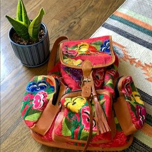 Beautiful patterned backpack with leather trim.